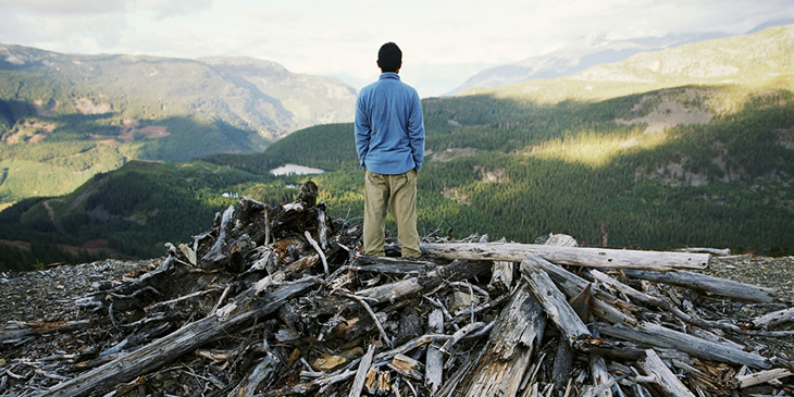Standing at the top of a hill overlooking the valley